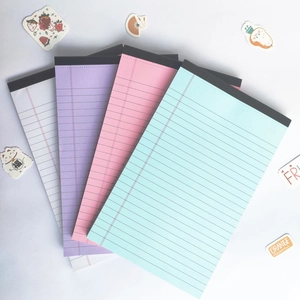 Set of four colorful American legal pads with top binding and blue ruled paper