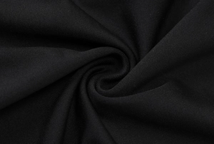 Gros plan détaillé du tissu en maille côtelée noire avec une texture extensible