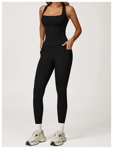 Close-up of black two-piece yoga set featuring a square neck top and leggings with side pockets