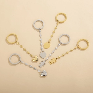 Minimalist stainless steel keychains with heart and girl charms in gold and silver