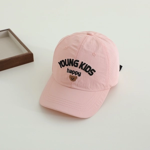 Detailed view of pink breathable kids cap with brown bear and happy letter embroidery