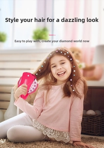 Close-up of pink hair bedazzler tool with colorful gems on girl's hair for DIY styling
