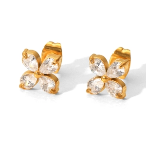 Detailed close-up of gold-plated flower stud earrings with teardrop zirconia petals
