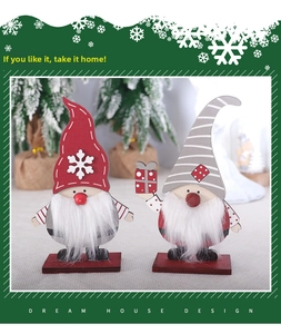 Detail of wooden Christmas gnomes with faux fiber beards and snowflake pattern hats