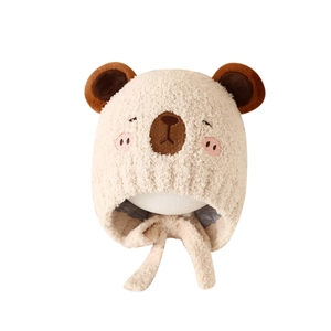 Plush beige baby earflap hat with cute brown bear ears and cozy chin strap ties