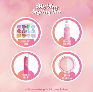 Detail view of pink pretend makeup kit components including eyeshadow and lipstick