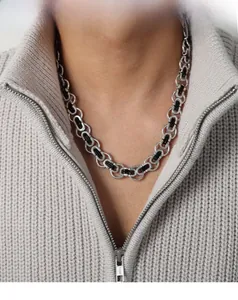Close-up of men's chunky titanium steel chain necklace with black geometric accents
