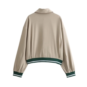 Back view of beige casual jacket featuring green and white striped ribbed cuffs and hem