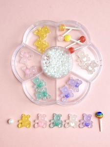 Colorful resin gummy bear and candy nail charms in a flower storage box