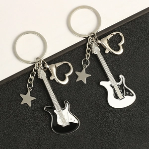 Guitar shaped metal keychains in black and white finish with star and heart charms