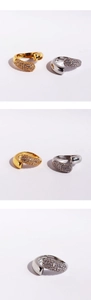 Detailed close-up of open rings with micro-paved cubic zirconia in gold and silver finish