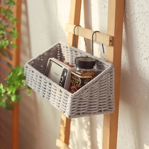 Gray woven cotton rope wall hanging basket with metal hooks for bedroom storage