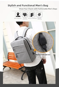 Gray business laptop backpack featuring a side-mounted USB charging port for commuters
