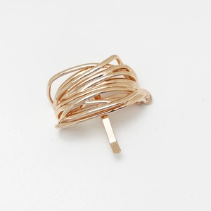 Detailed view of the gold alloy U-shaped multi-loop hair hook with back insert pin