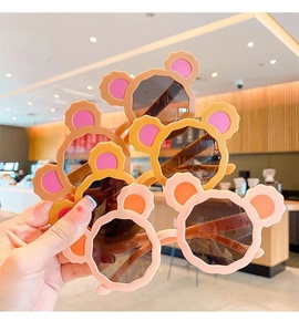Detailed close-up showing multiple pairs of cute children's bear ear sunglasses in pastel colors
