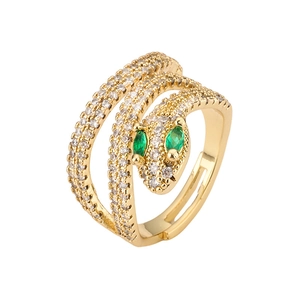 Adjustable gold snake ring with sparkling zircons and emerald green gemstone eyes