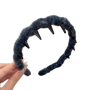 Blue-grey knitted wavy headband with black decorative spikes for autumn winter style