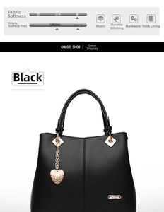 Detail view of black faux leather tote with golden heart charm and metal logo hardware