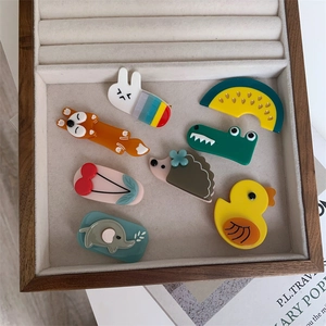 Set of eight assorted acetate hair clips with cute animal and fruit cartoon shapes