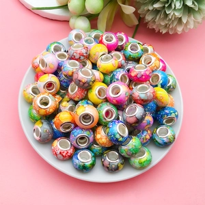 Close-up of colorful ink-painted large hole beads for DIY jewelry making and bracelets