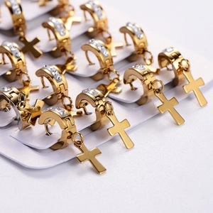 Gold cross drop earrings with sparkling crystals on a clean white display card