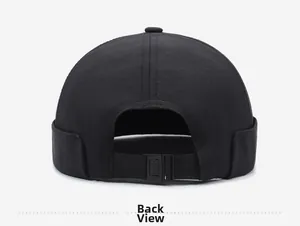 Rear view of black cotton docker hat featuring an adjustable strap and six-panel stitch detail