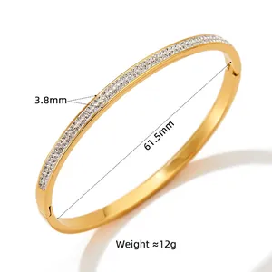 Golden stainless steel bangle with double-row sparkling crystals and polished finish