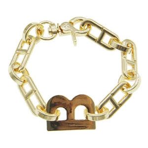 Detailed close-up of a gold metal link bracelet featuring a polished letter B pendant