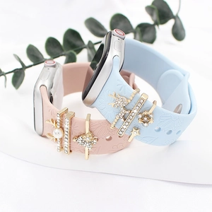 Silicone Apple Watch band with floral embossed patterns and Christmas reindeer charms