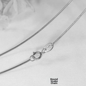 Detail of S925 sterling silver stamp on a minimalist round snake chain necklace