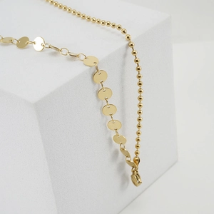 18k gold plated stainless steel anklet with chic coin disks and bead chain on white cube