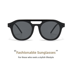 Close-up of geometric black frame sunglasses with dark grey lenses and double bridge detail