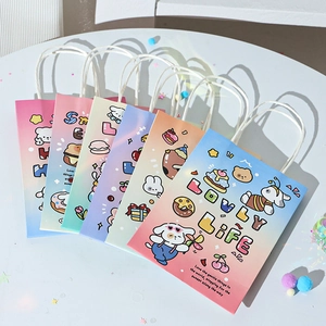 Close-up of colorful cartoon animal paper gift bags with white rope handles and lovely patterns