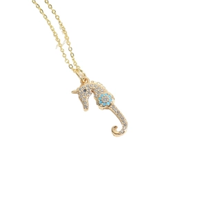 Elegant gold seahorse pendant necklace with white diamonds and light blue accents