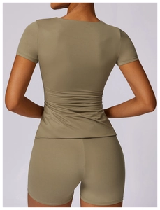 Detail view of the olive green quick-dry yoga set showing fitted back design and fabric texture