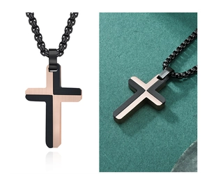 Detail of two-tone cross necklace in black and rose gold with a woven chain cord