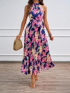 Detail of elegant halter neck floral maxi dress featuring pleated chiffon and waist tie