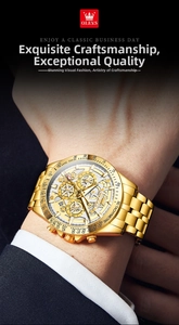 Close-up of gold chronograph watch with skeleton dial on man's wrist in a formal suit