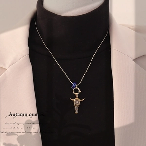Vintage bull head pendant necklace with evil eye bead on a golden ball chain