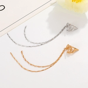 Minimalist gold and silver long chain tassel ear cuff with textured metal spikes