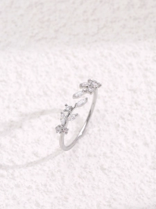 Detail of silver leaf ring with marquise-cut zircon stones and adjustable open band