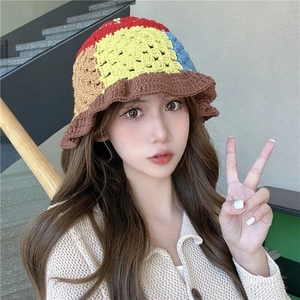 Handmade colorful crochet bucket hat with wavy brim for women in a knit patchwork design