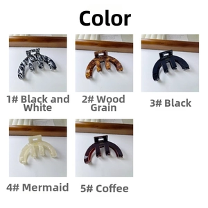 Collection of large acetate hair claws in tortoise shell, black, and pearlescent finishes