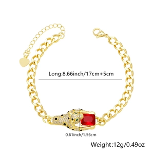 Detail view of gold Cuban link bracelet featuring leopard head with red gemstone and zircon