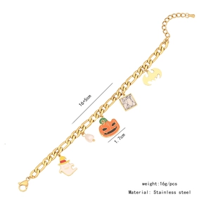 Detail of golden stainless steel Halloween bracelet with ghost and pumpkin charms