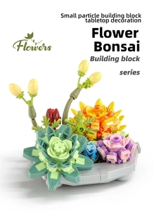 Close-up of succulent building blocks and yellow flower buds in a grey hexagonal pot