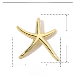 Detail view of a golden starfish pendant with dimensions 30mm and copper material specs