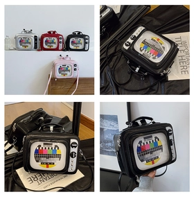 Close-up of retro TV-shaped crossbody bags in silver, red, black, and pink colors