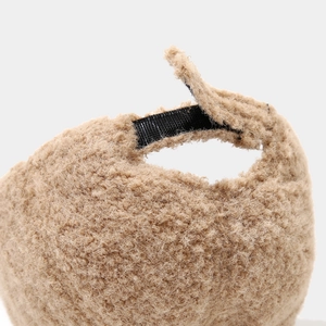 Close-up of adjustable velcro strap on light brown fleece baseball cap for warmth