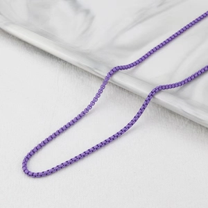 Macro detail of purple matte box chain necklace with smooth metallic texture links